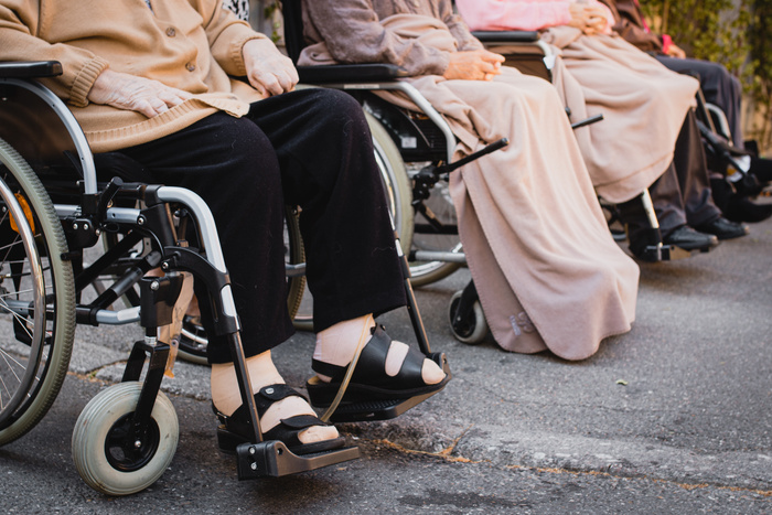 People Sitting on Wheelchairs